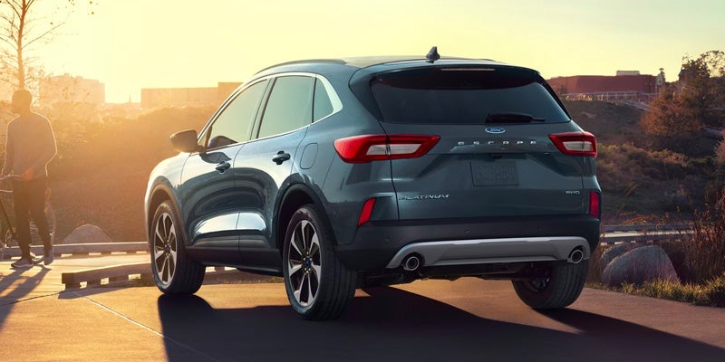 a 2024 Ford Escape with the sun setting over the hood